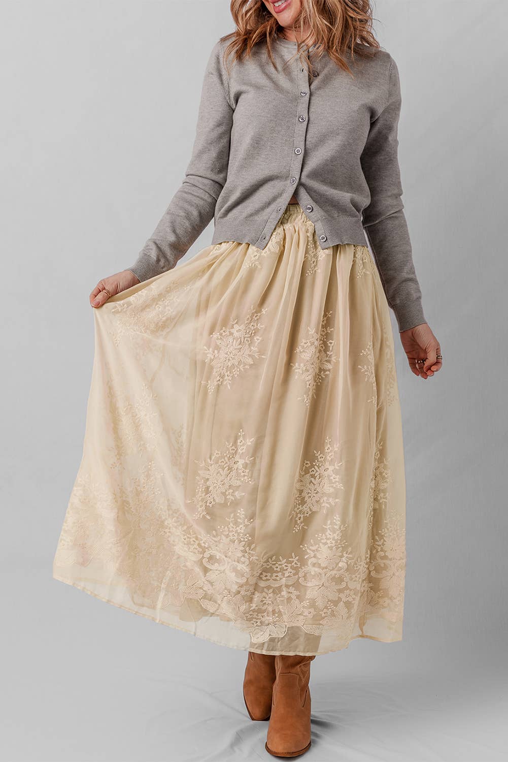 Woman wearing a beige lace skirt 