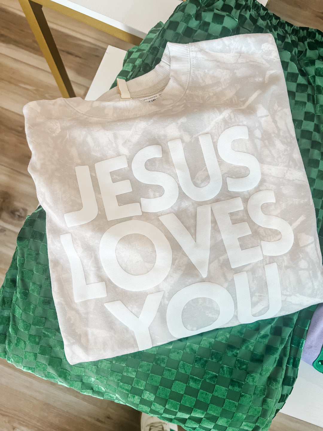 Came sweatshirt with 'Jesus Loves You' text 