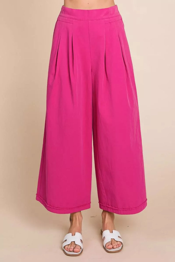 Pink wide-leg pants worn by a person 