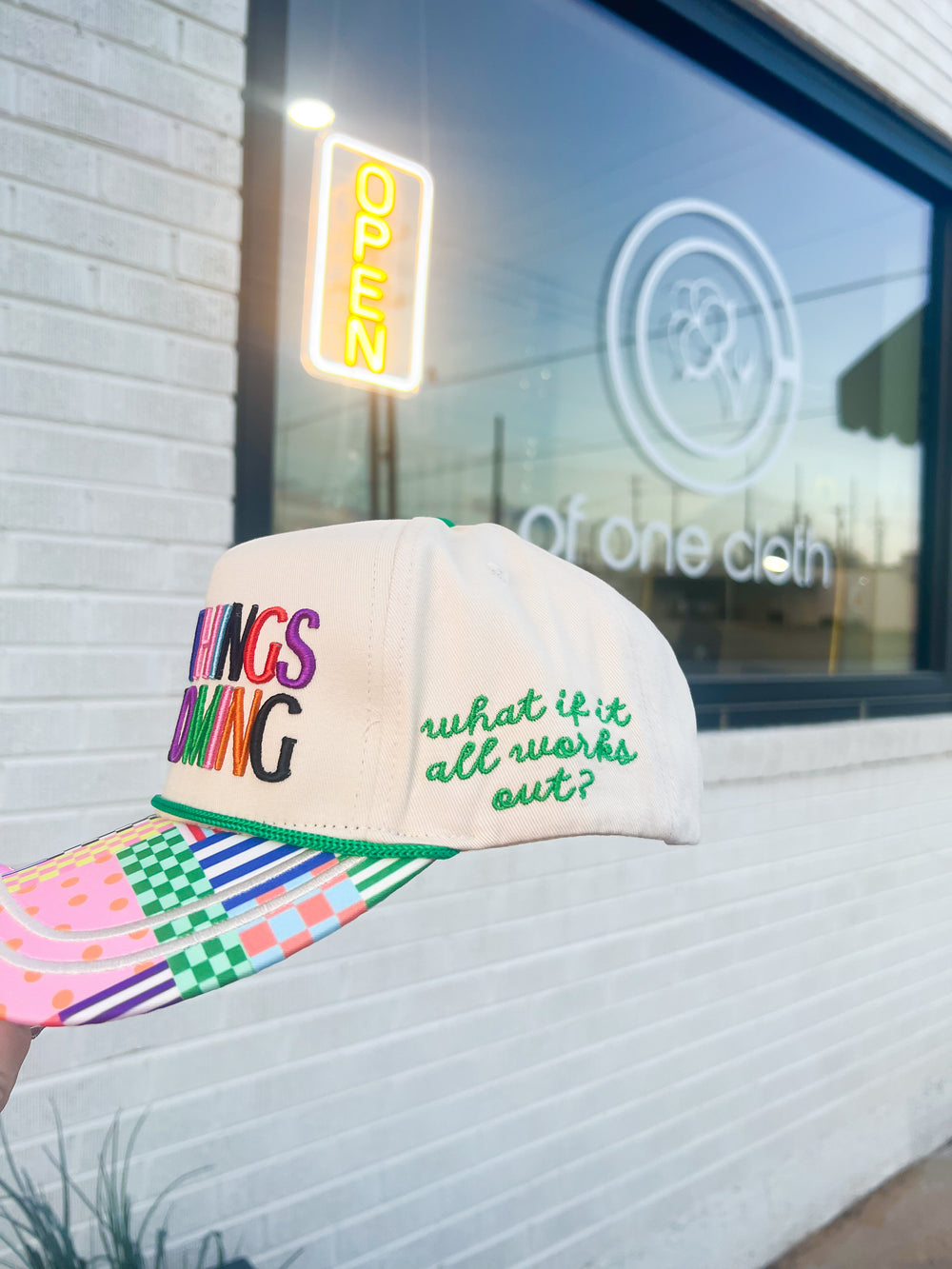 Colorful cap with text "What if it all works out"