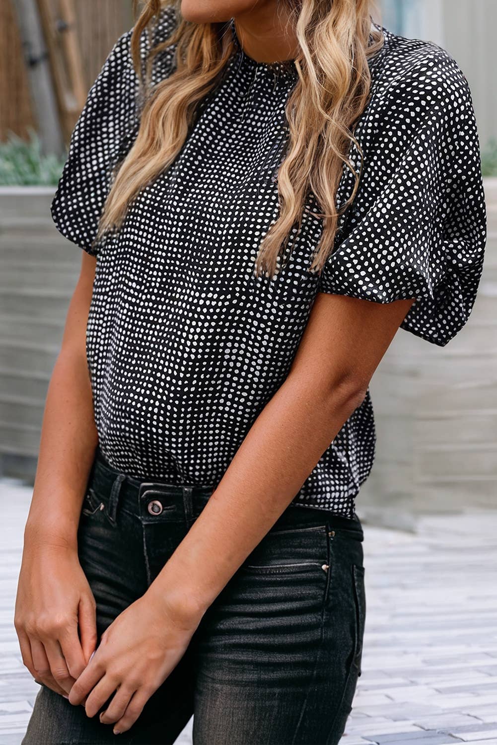 Woman wearing a black cheetah pattern shirt