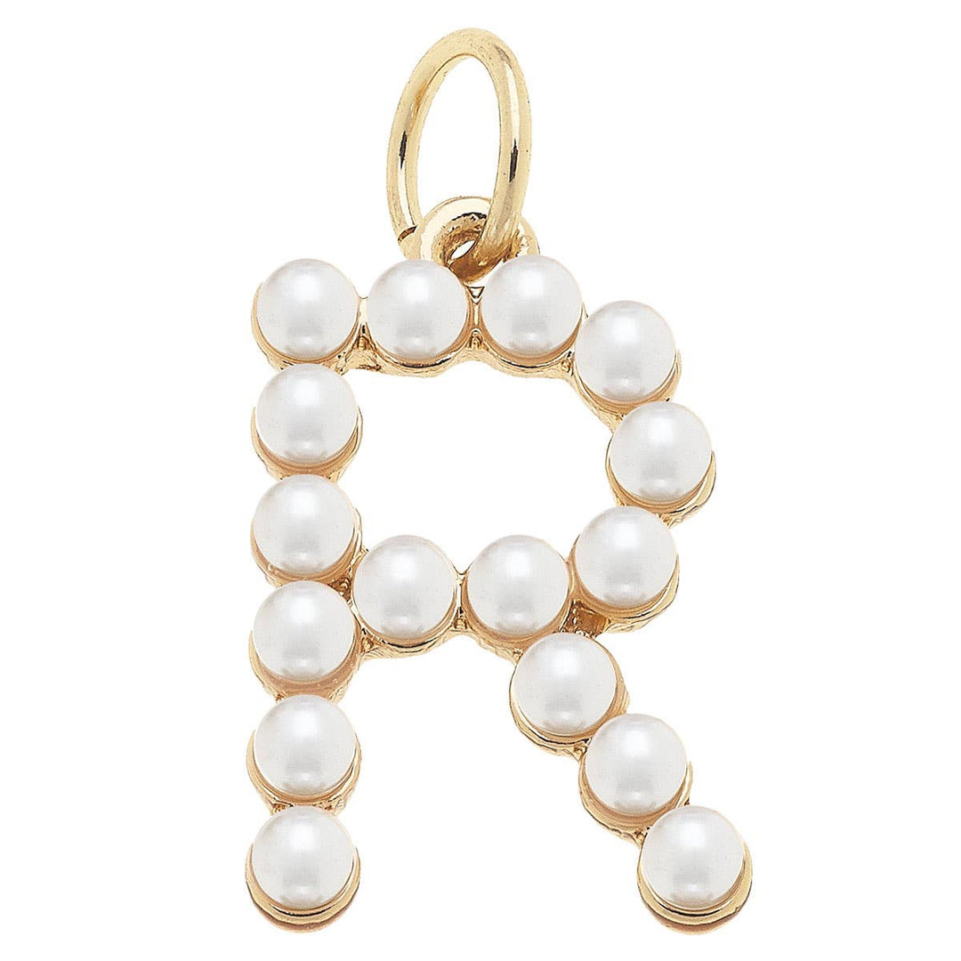 A gold-plated letter charm 'R' adorned with white pearls.