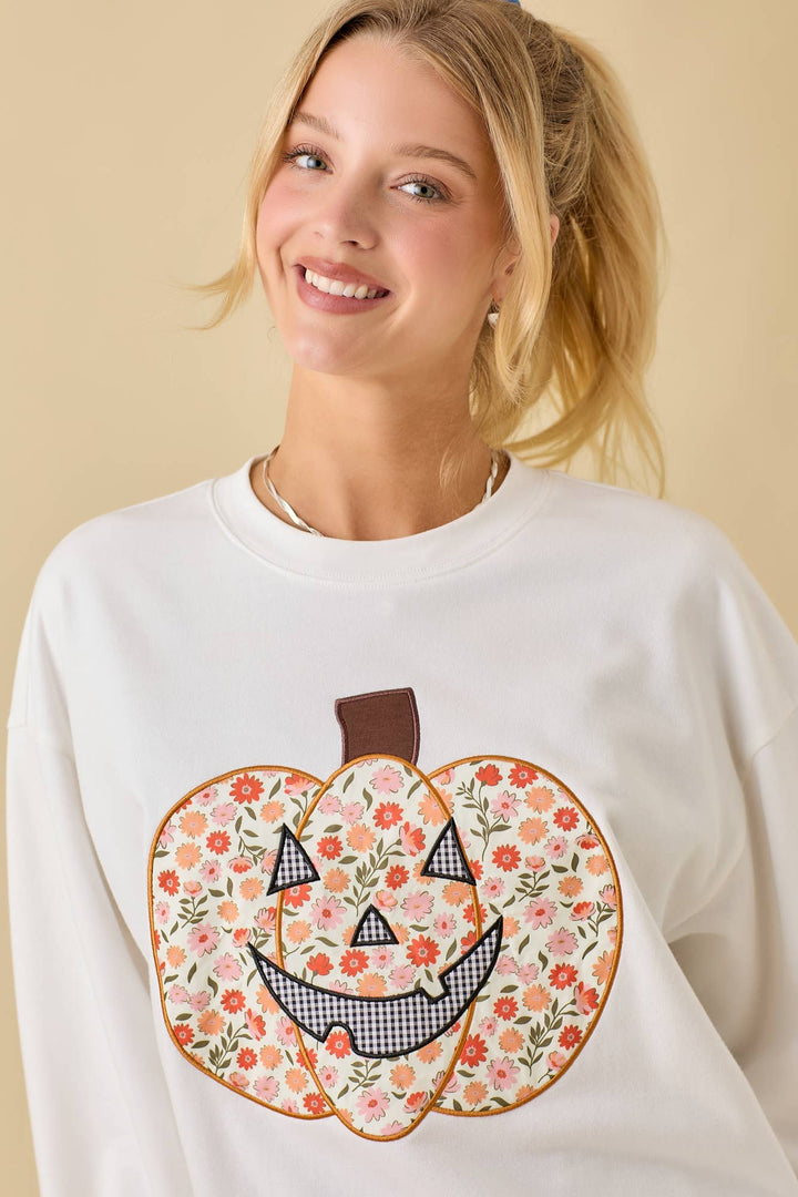 White sweatshirt with floral pumpkin design