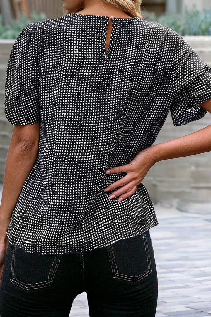 Woman wearing a black cheetah pattern shirt