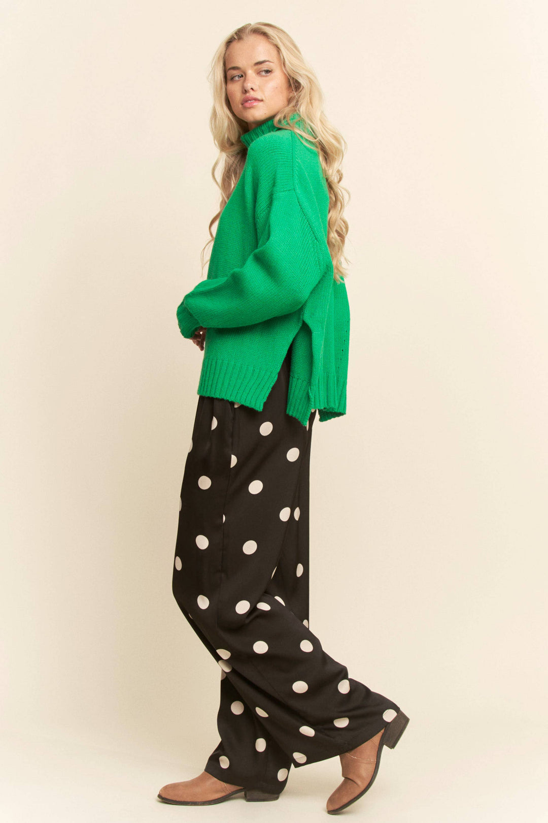 woman waring black pants with white polka dots