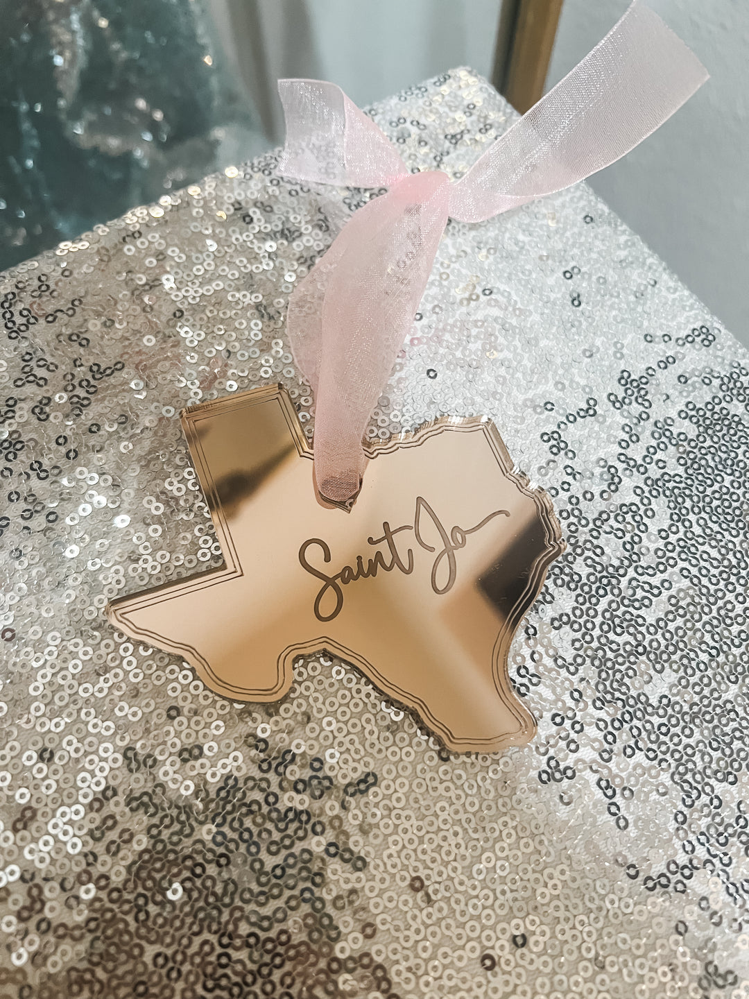 Rose Gold acrylic Texas-shaped ornament with 'Saint Jo' engraving