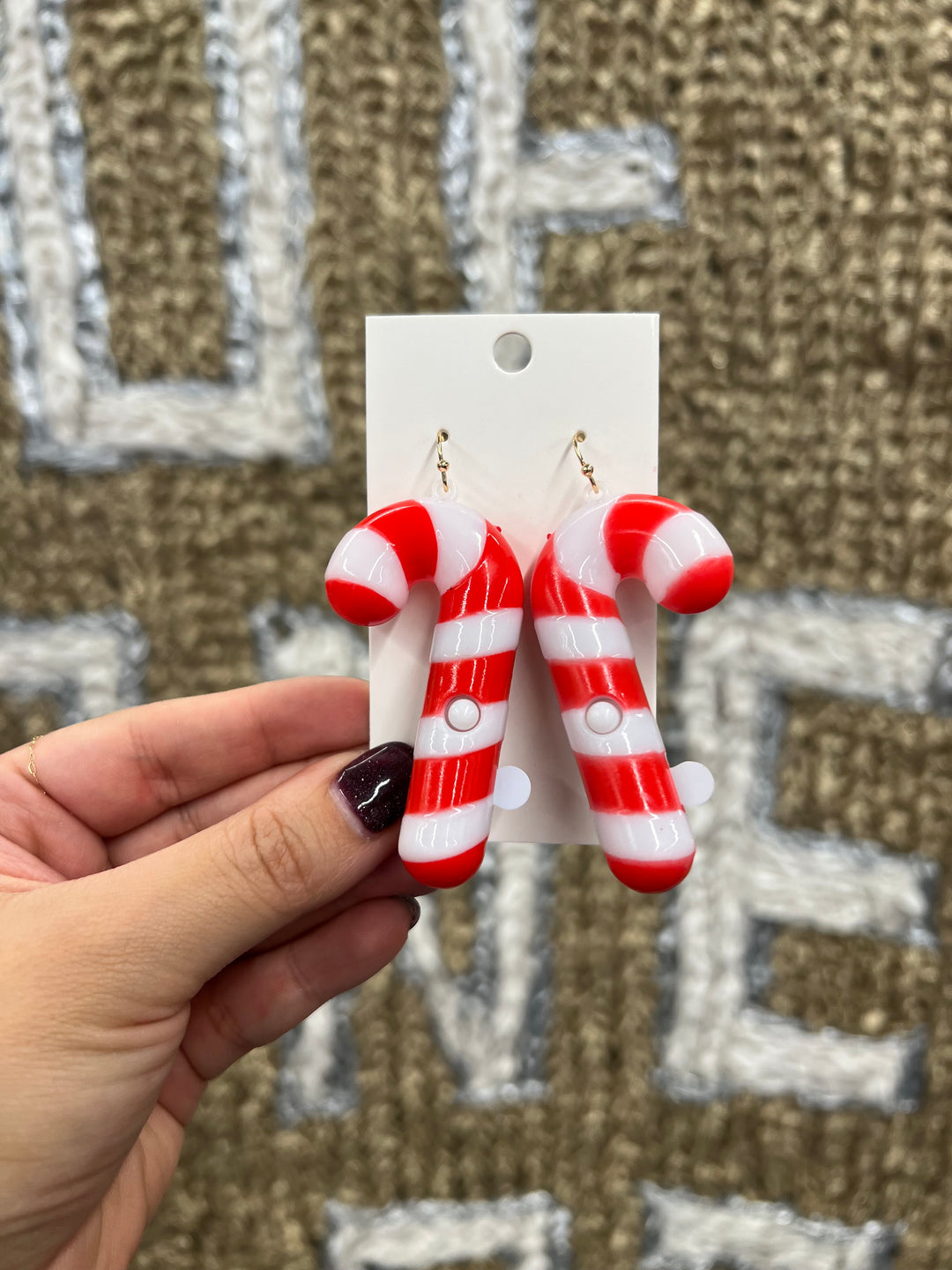 Red and white striped candy cane-shaped earrings 