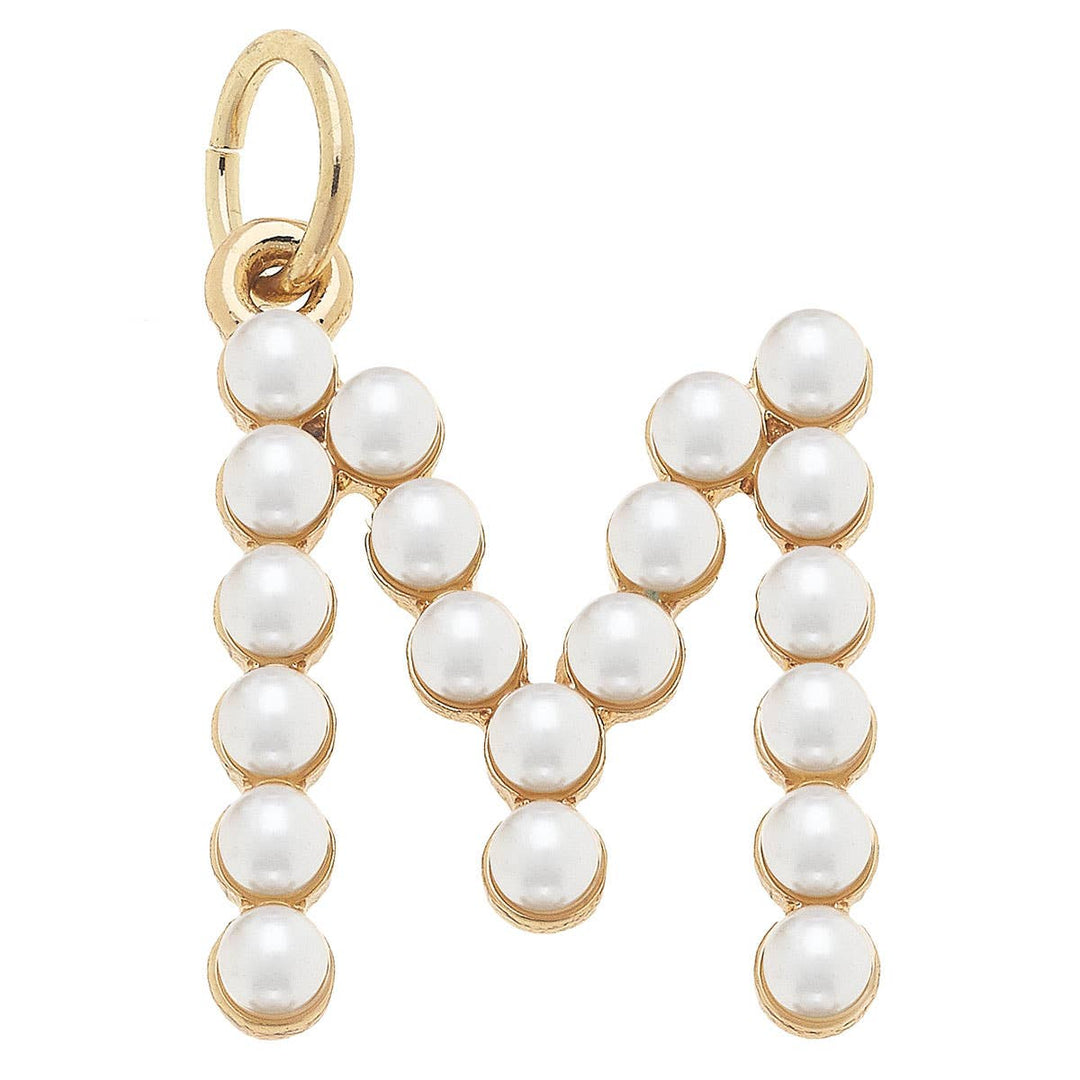A gold-plated letter charm 'M' adorned with white pearls.