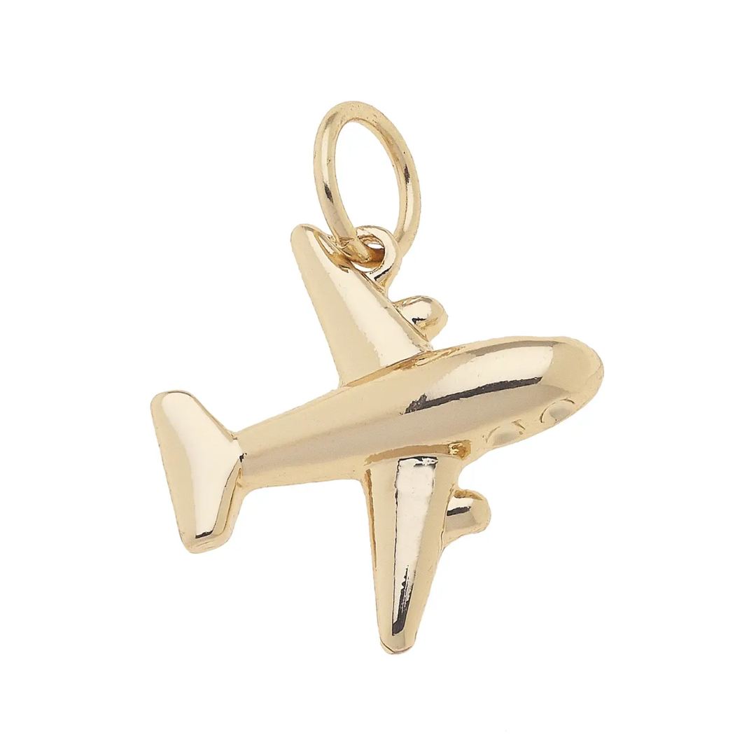 A shiny gold charms pendant designed as a jet airplane.