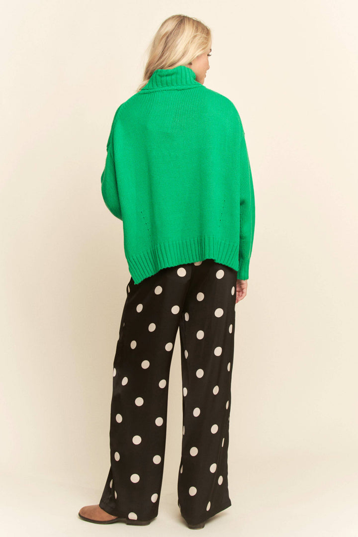 woman waring black pants with white polka dots