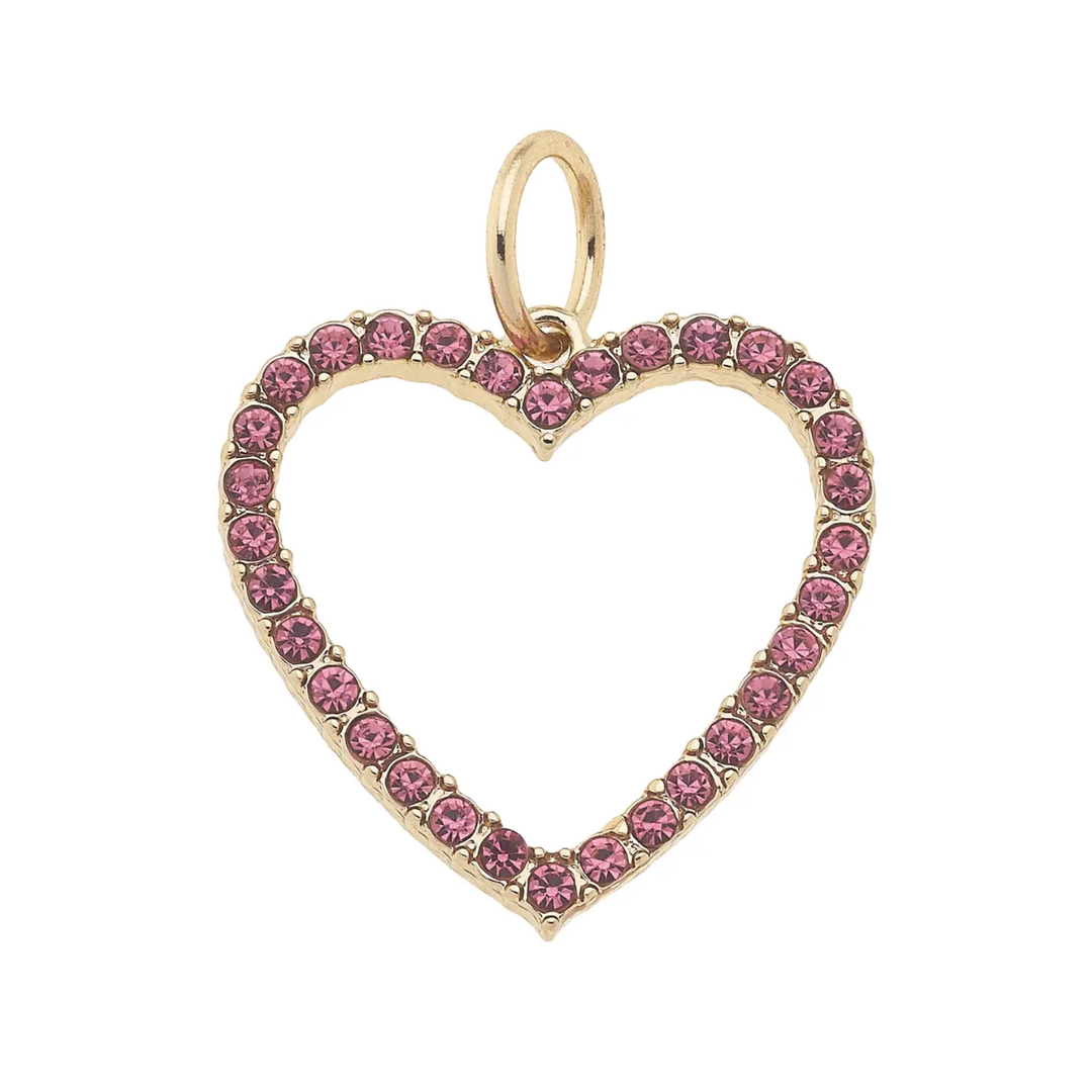 A gold-colored open heart-shaped charm encrusted with pink rhinestones.