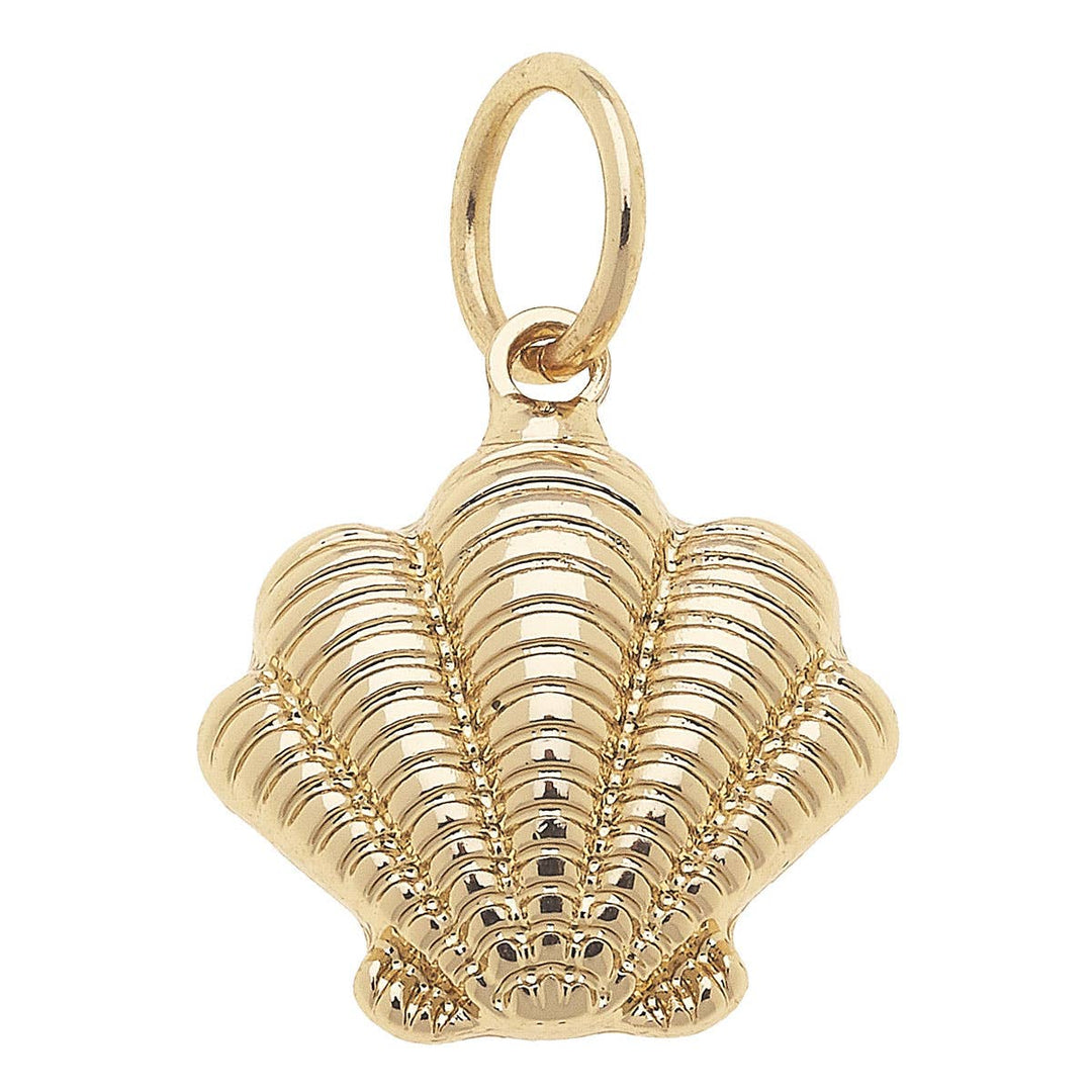 A shiny gold ribbed clamshell charm