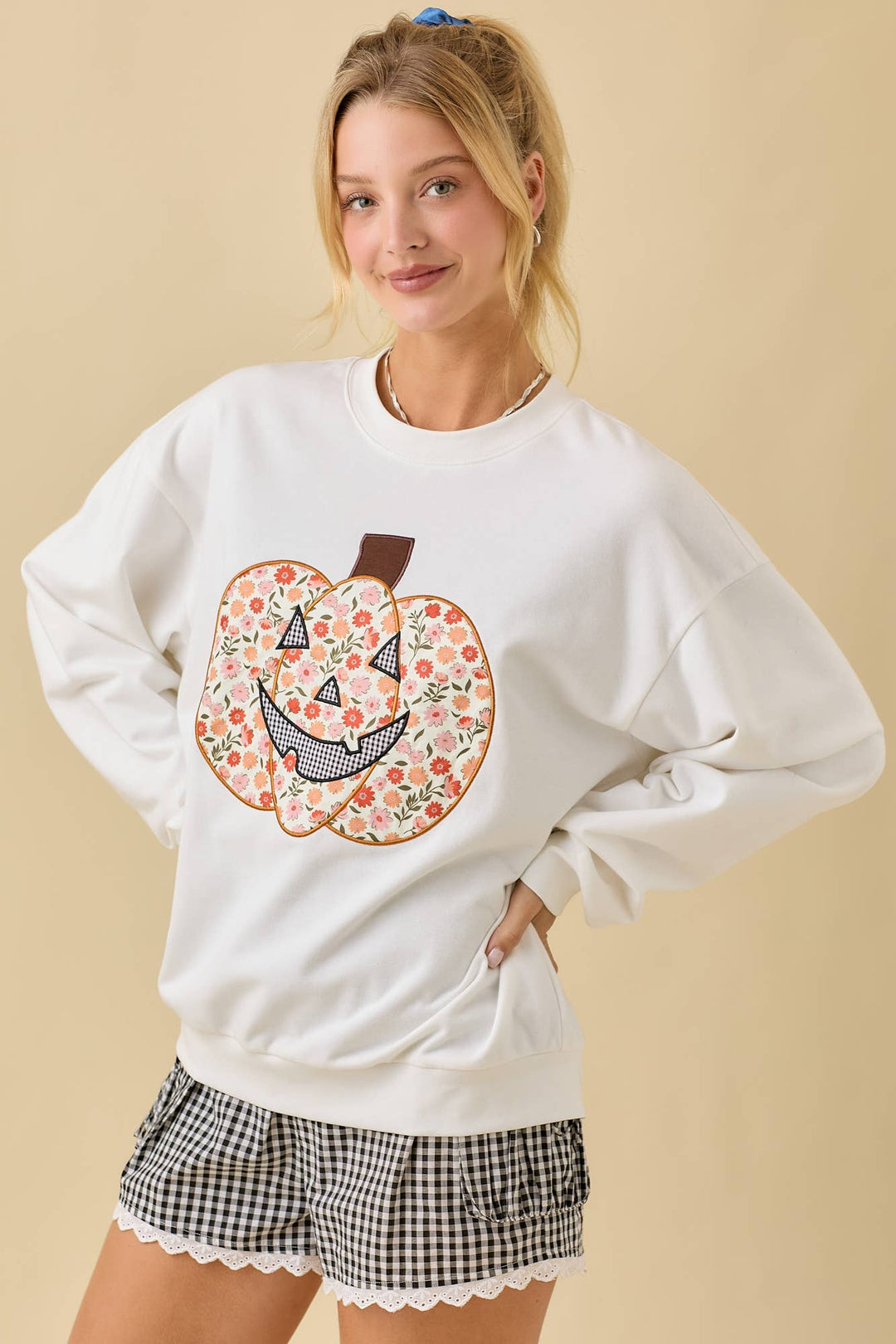White sweatshirt with floral pumpkin design