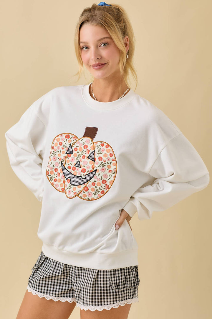 White sweatshirt with floral pumpkin design