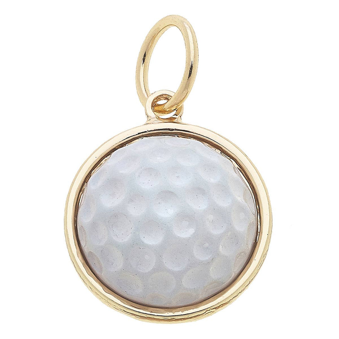 A white golf ball enamel charm with a gold plating, designed to be attached to a necklace or bracelet.
