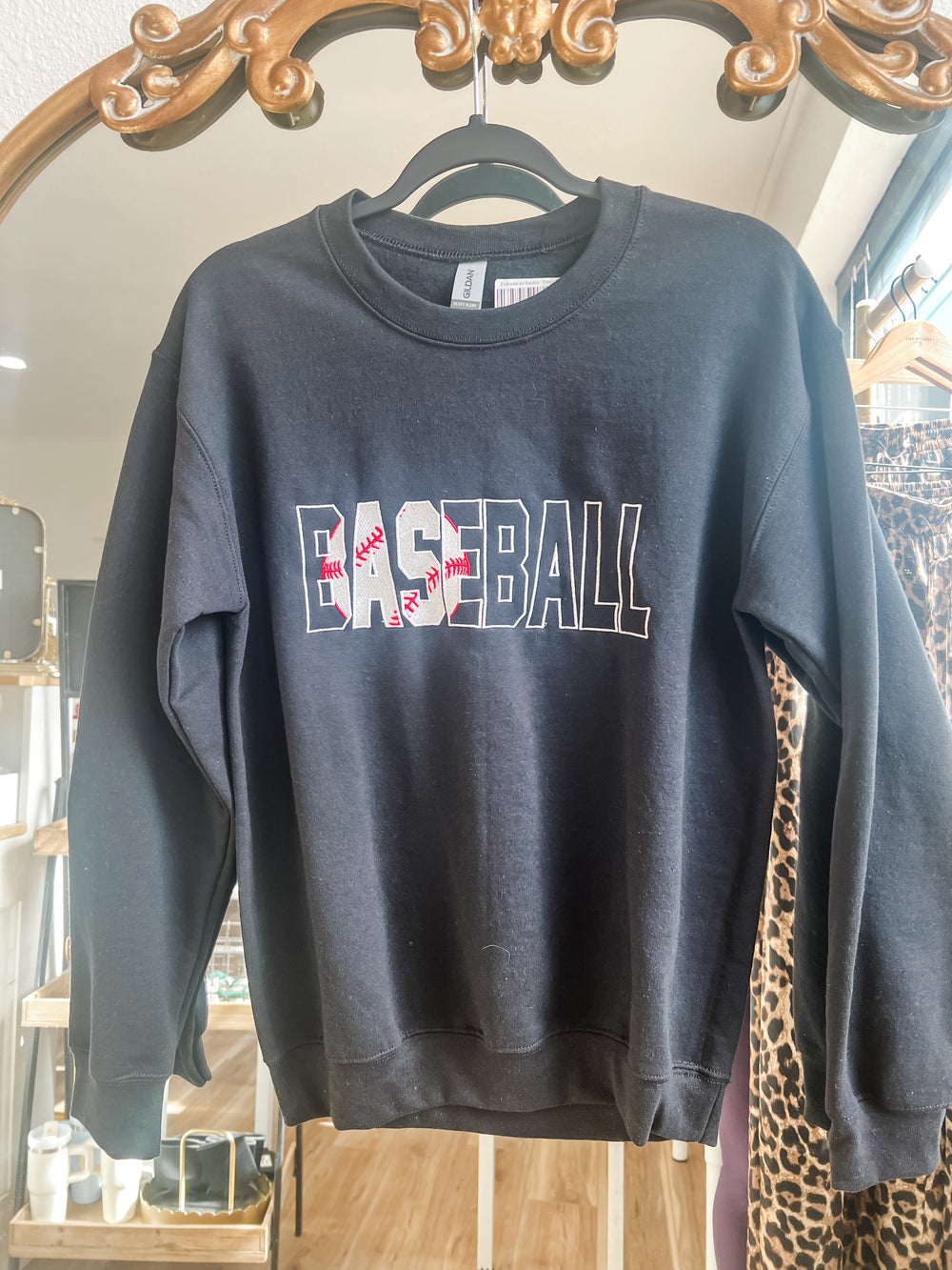 black sweatshirt with 'BASEBALL' embroidered