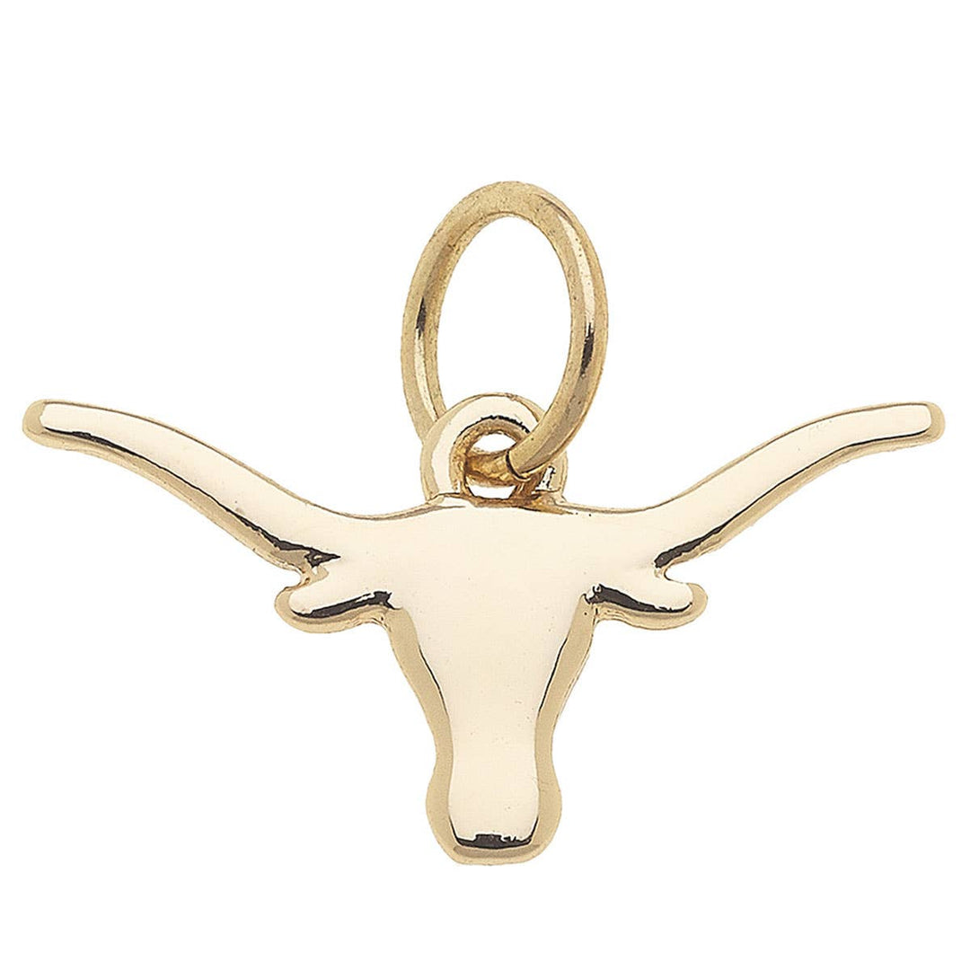 A shiny gold charm in the shape of the Texas Longhorn