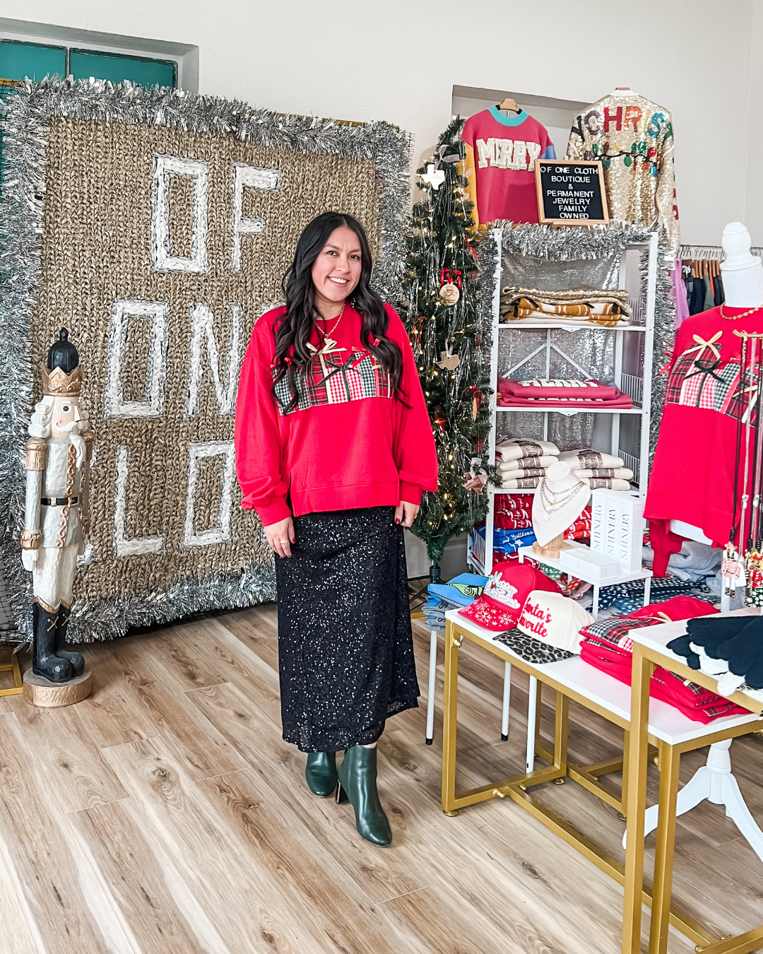 woman in a red sweater with gifts embroidered 