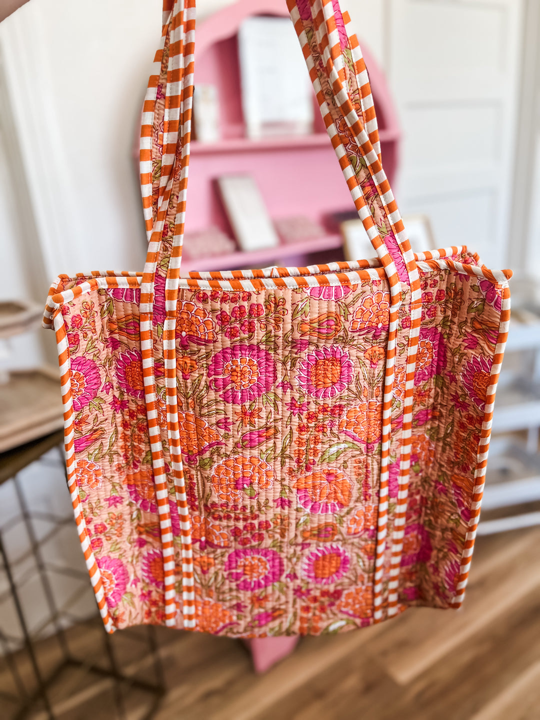 Floral patterned bag with orange and pink design