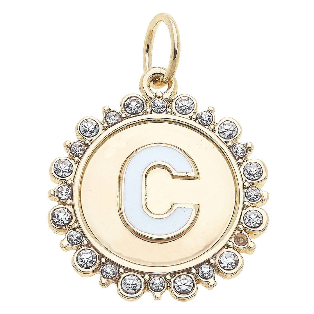 A shiny gold disc charm with the letter C studded with rhinestones around the edge.
