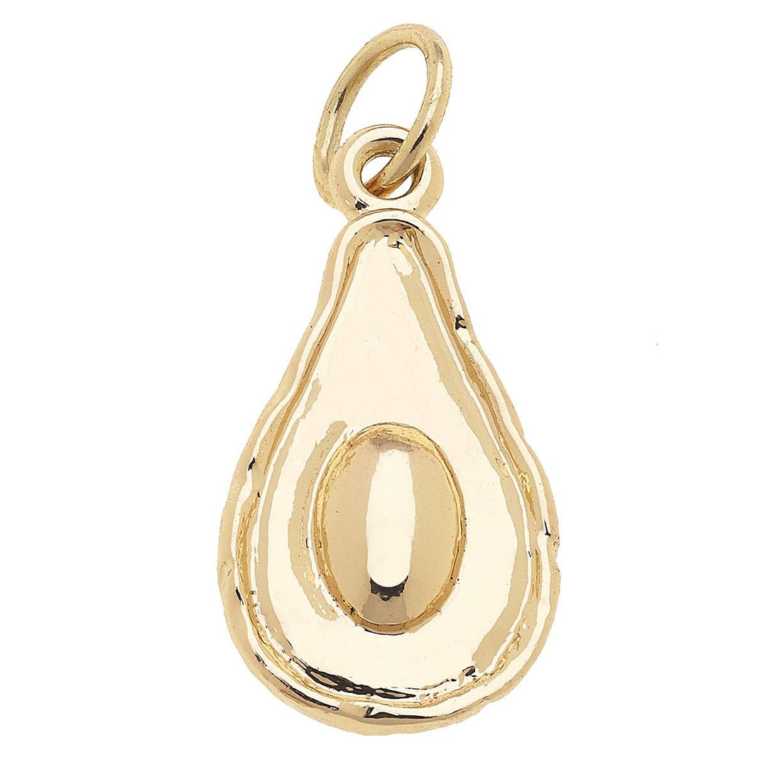 A gold-colored charm in the shape of an avocado.
