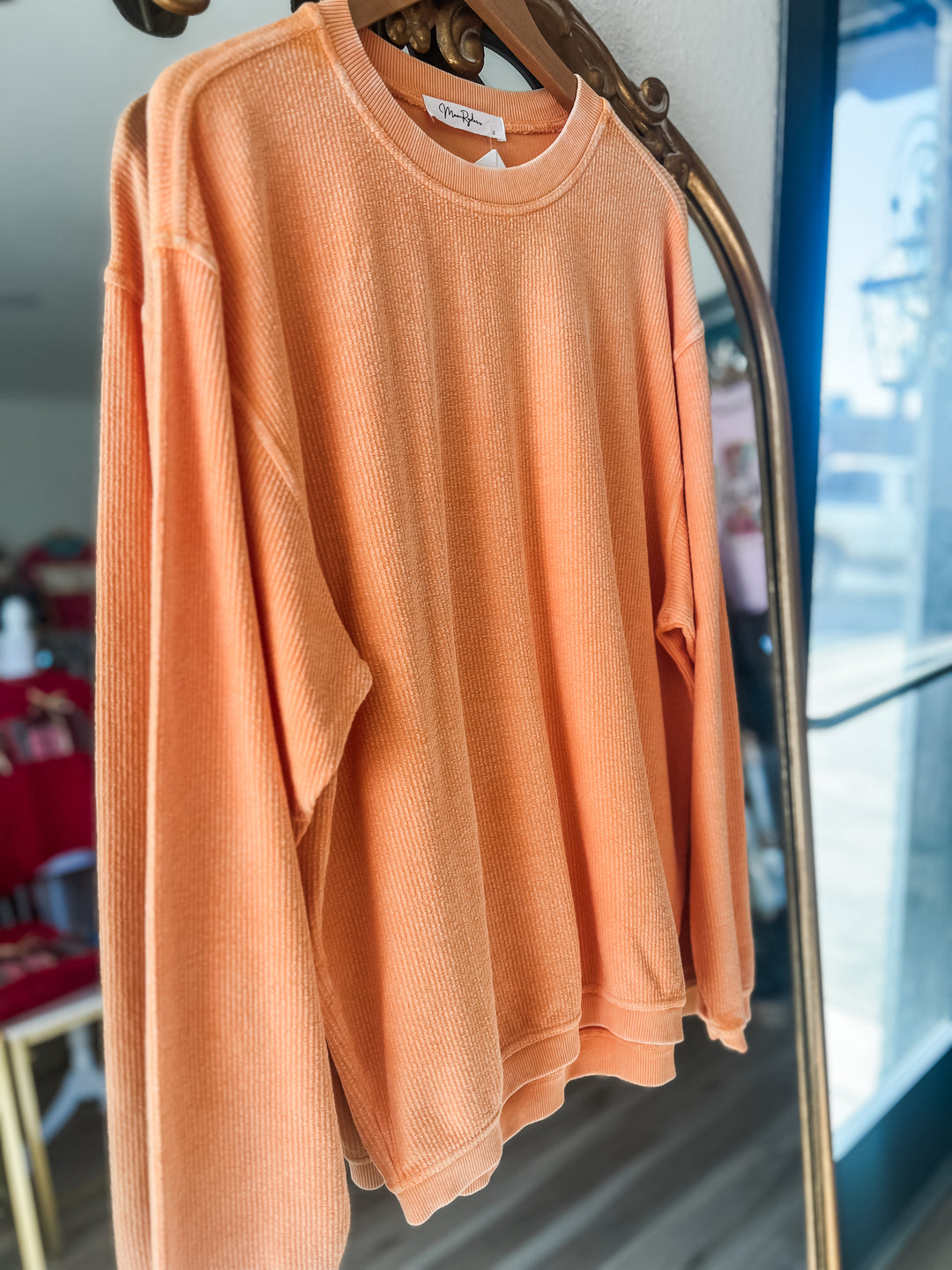 Orange long sleeved corded crew