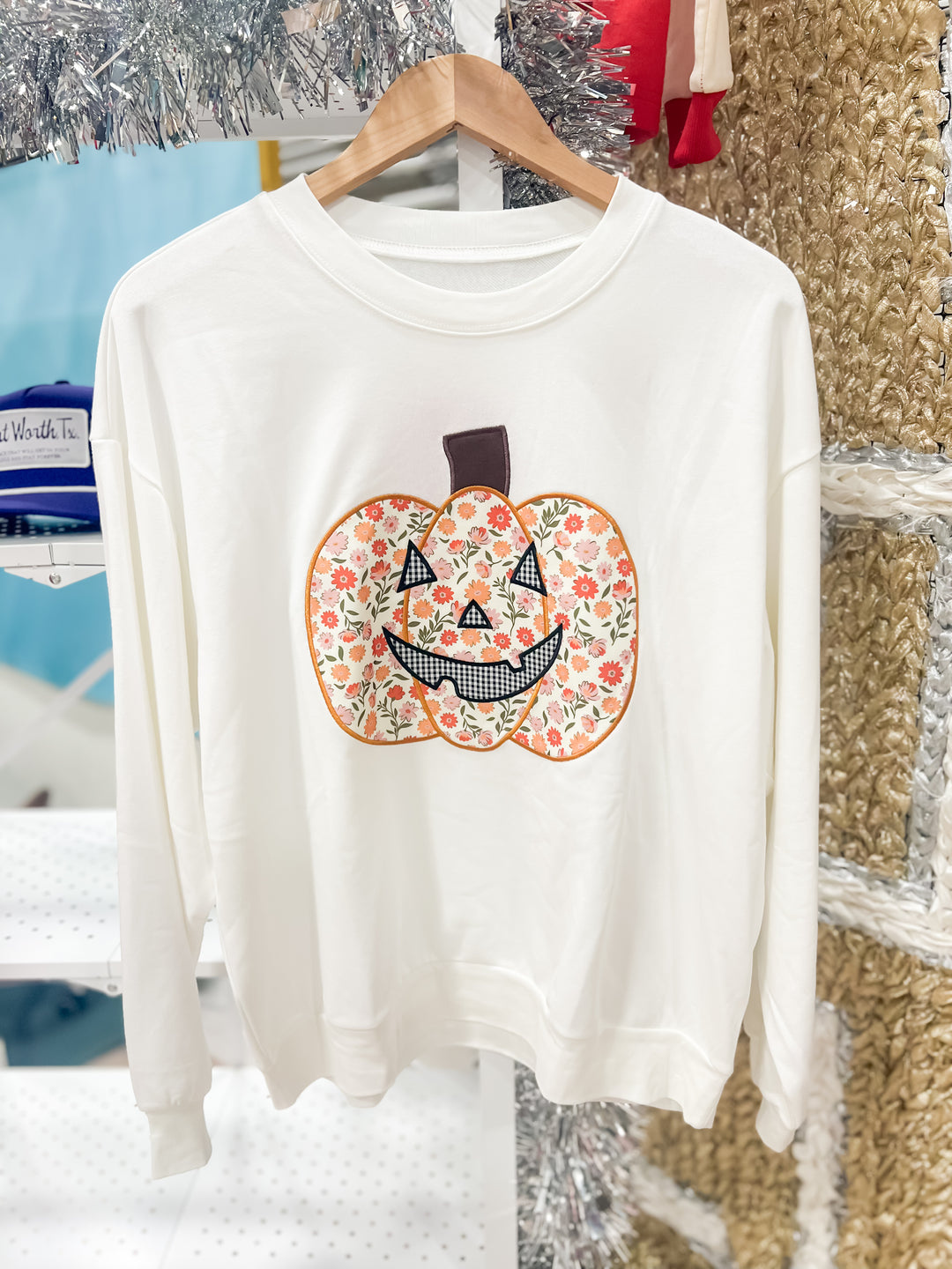 White sweatshirt with floral pumpkin design