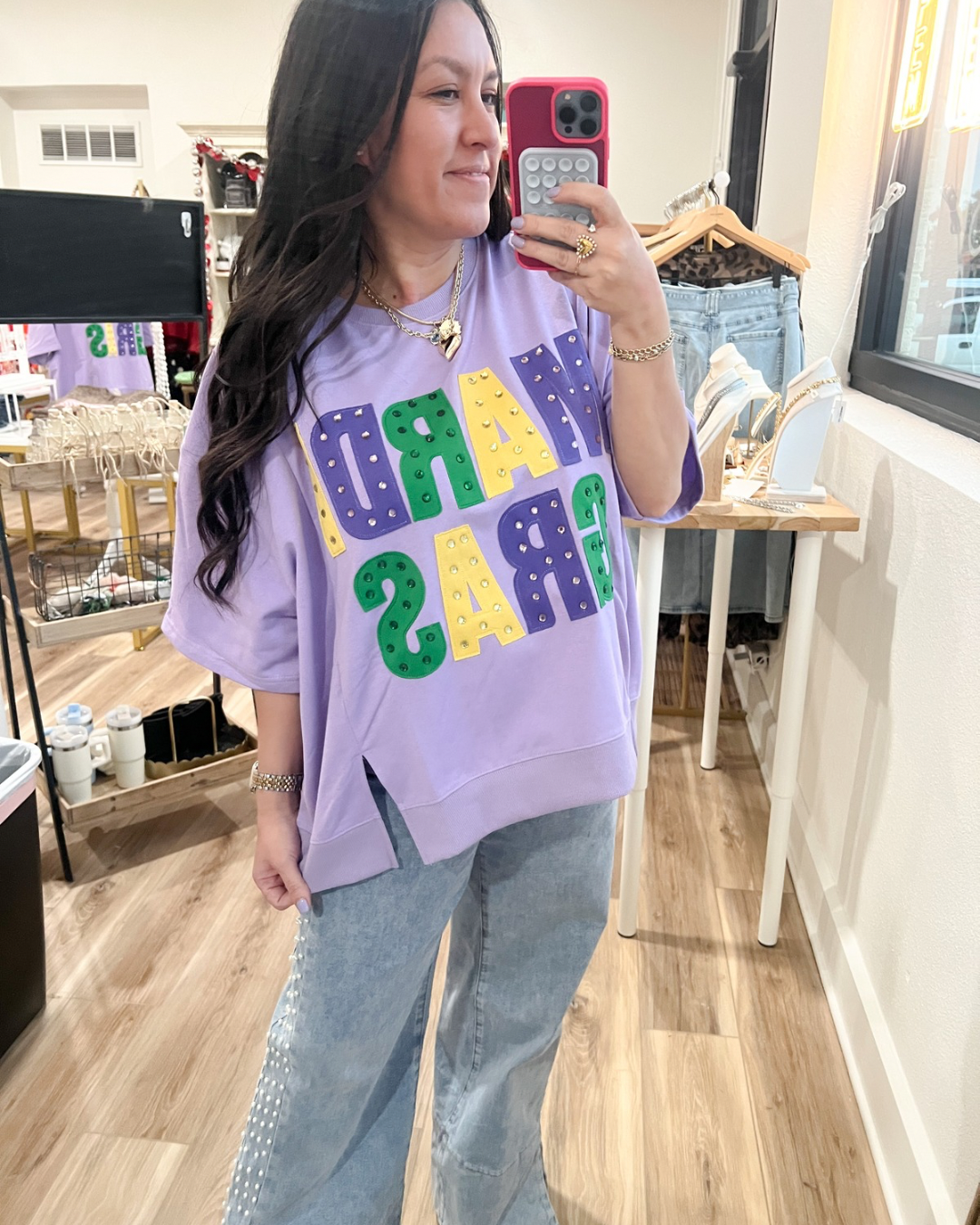 Womane's purple oversized shirt with "Mardi Gras" text