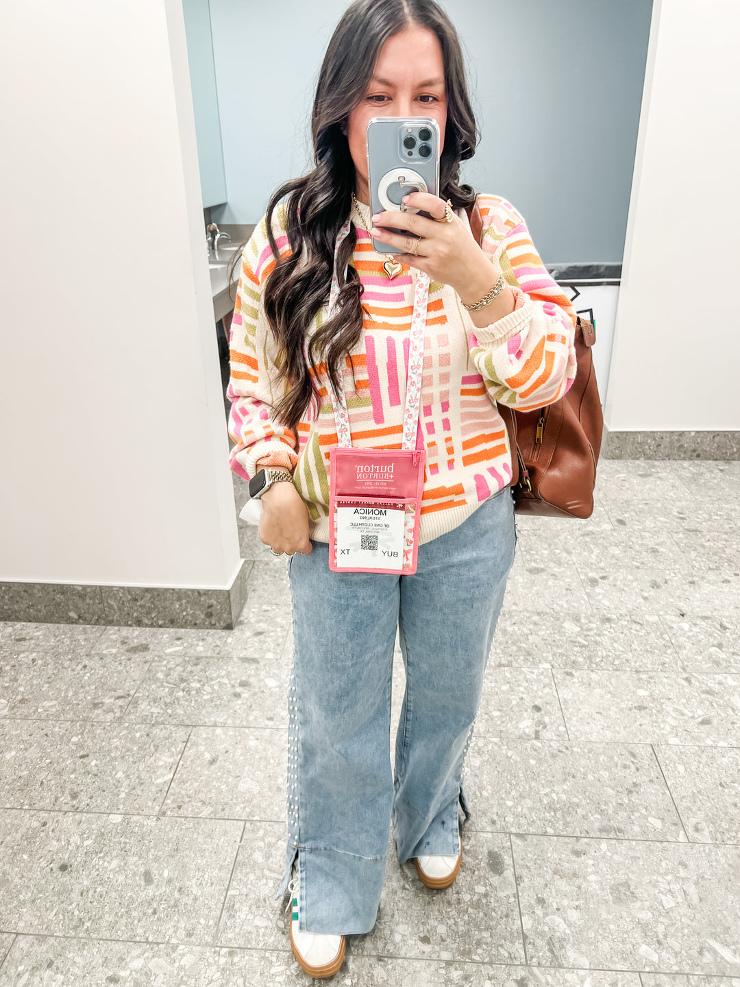 Woman wearing a colorful striped pattern sweater