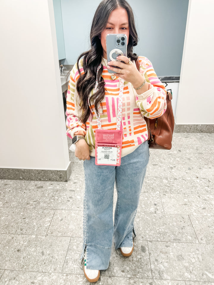 Woman wearing a colorful striped pattern sweater