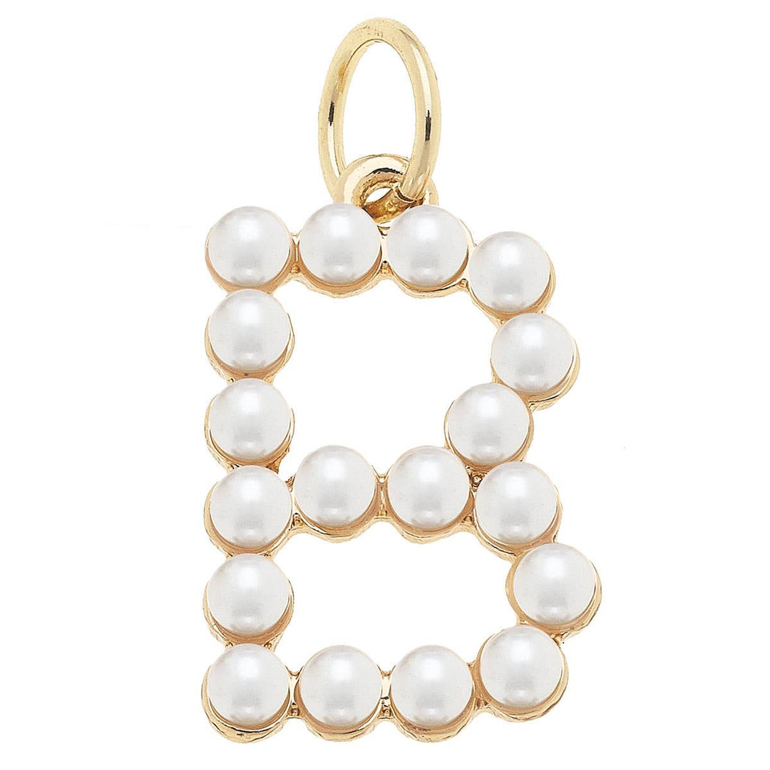 Gold 'B' charm with white pearls on a white background
