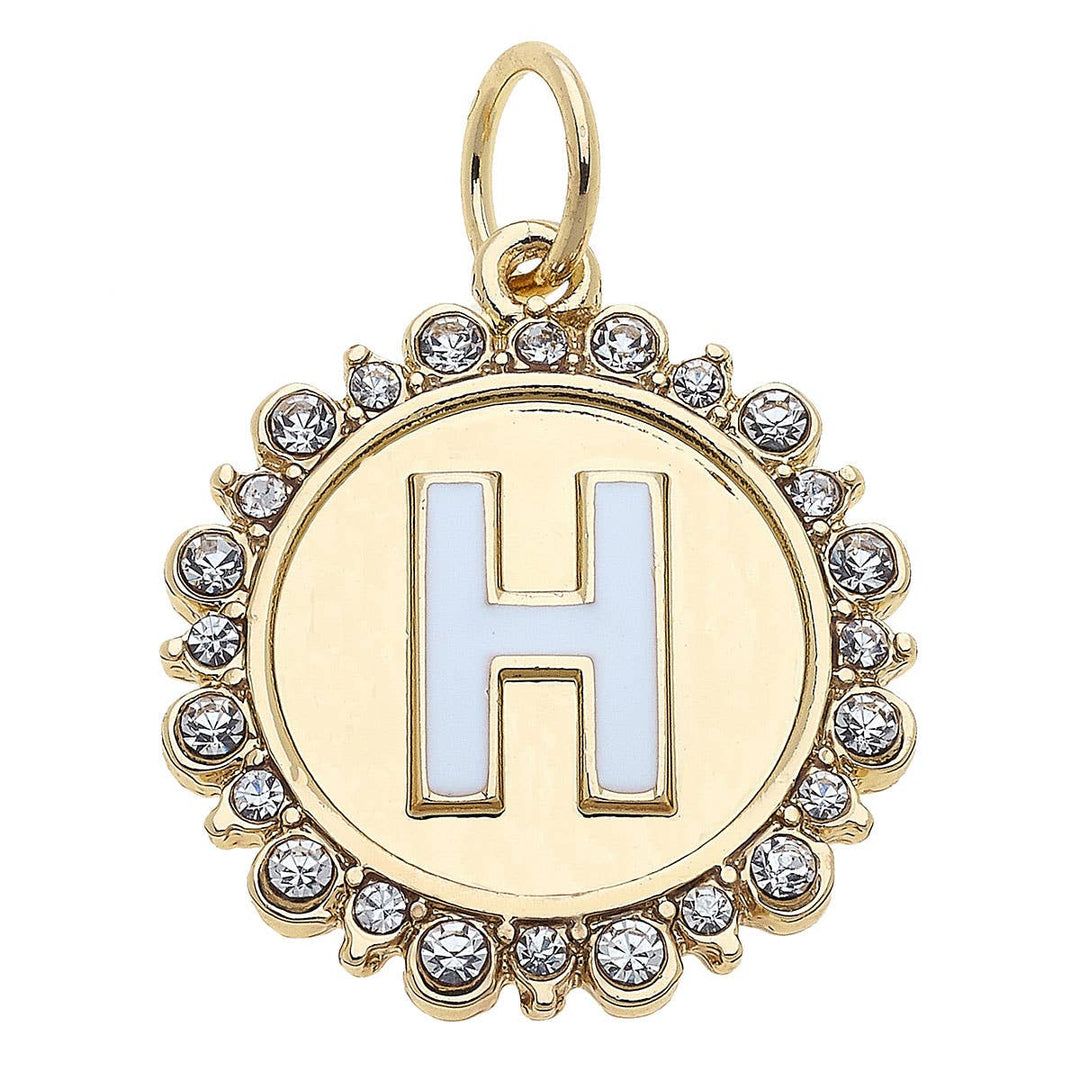 Gold pendant with letter 'H' and crystal accents on a white background