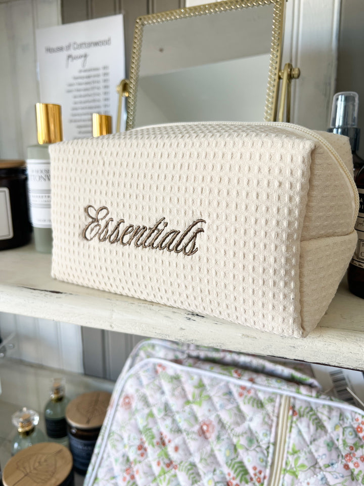 Beige toiletry bag with &