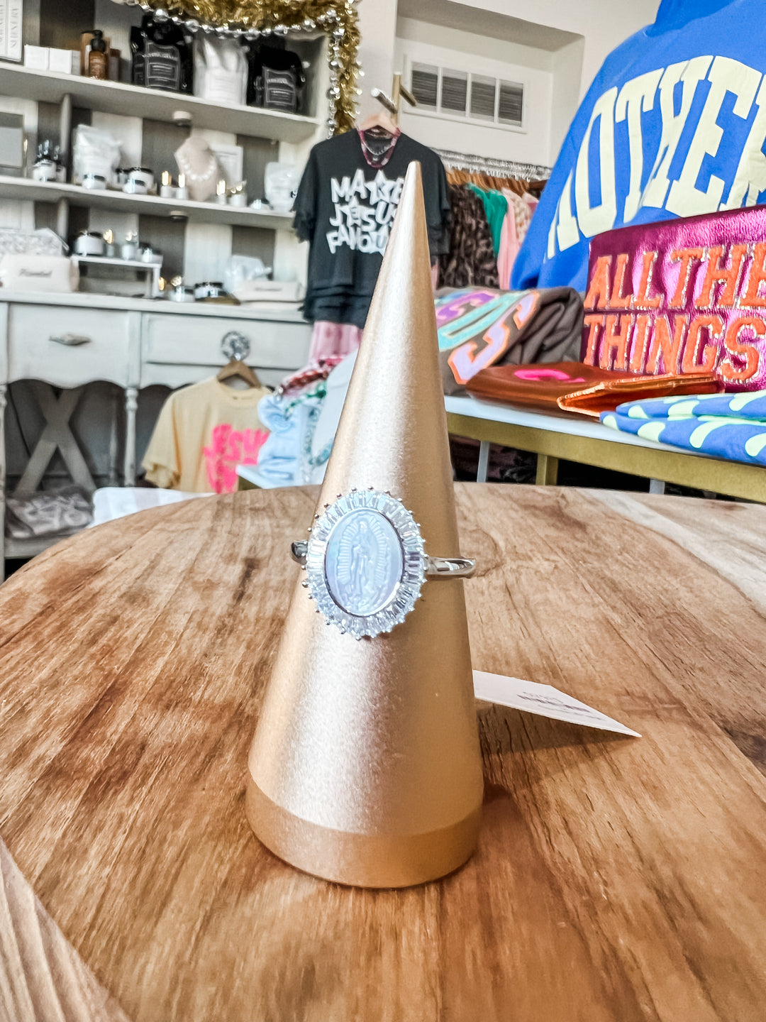 Sterling silver oval medallion ring with detailed halo setting