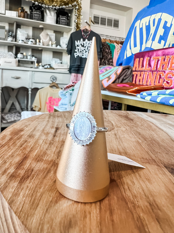 Sterling silver oval medallion ring with detailed halo setting
