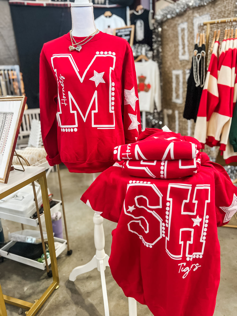 Red sweatshirt with 'SH Tigers' text and white stars