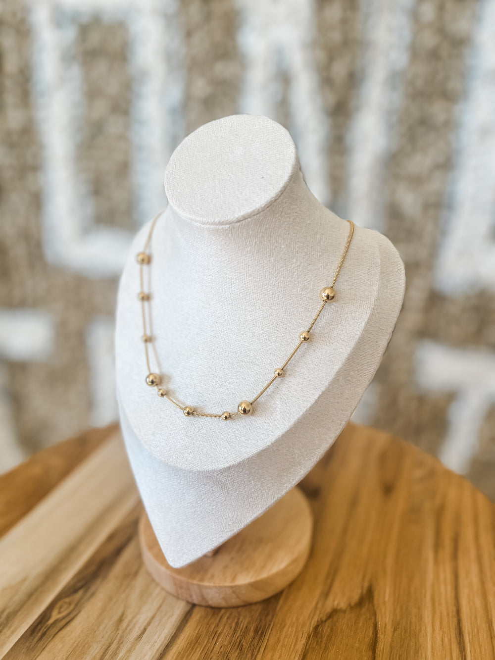 Gold chains and ball necklace