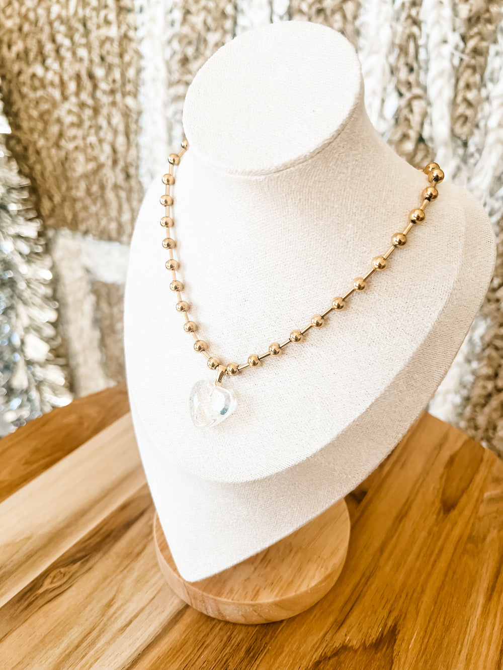 Gold necklace with clear heart pendant