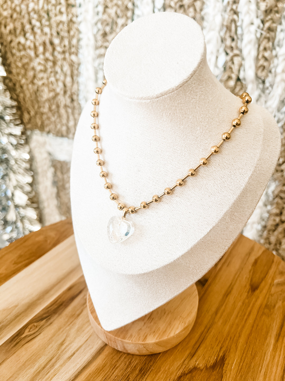 Gold necklace with clear heart pendant