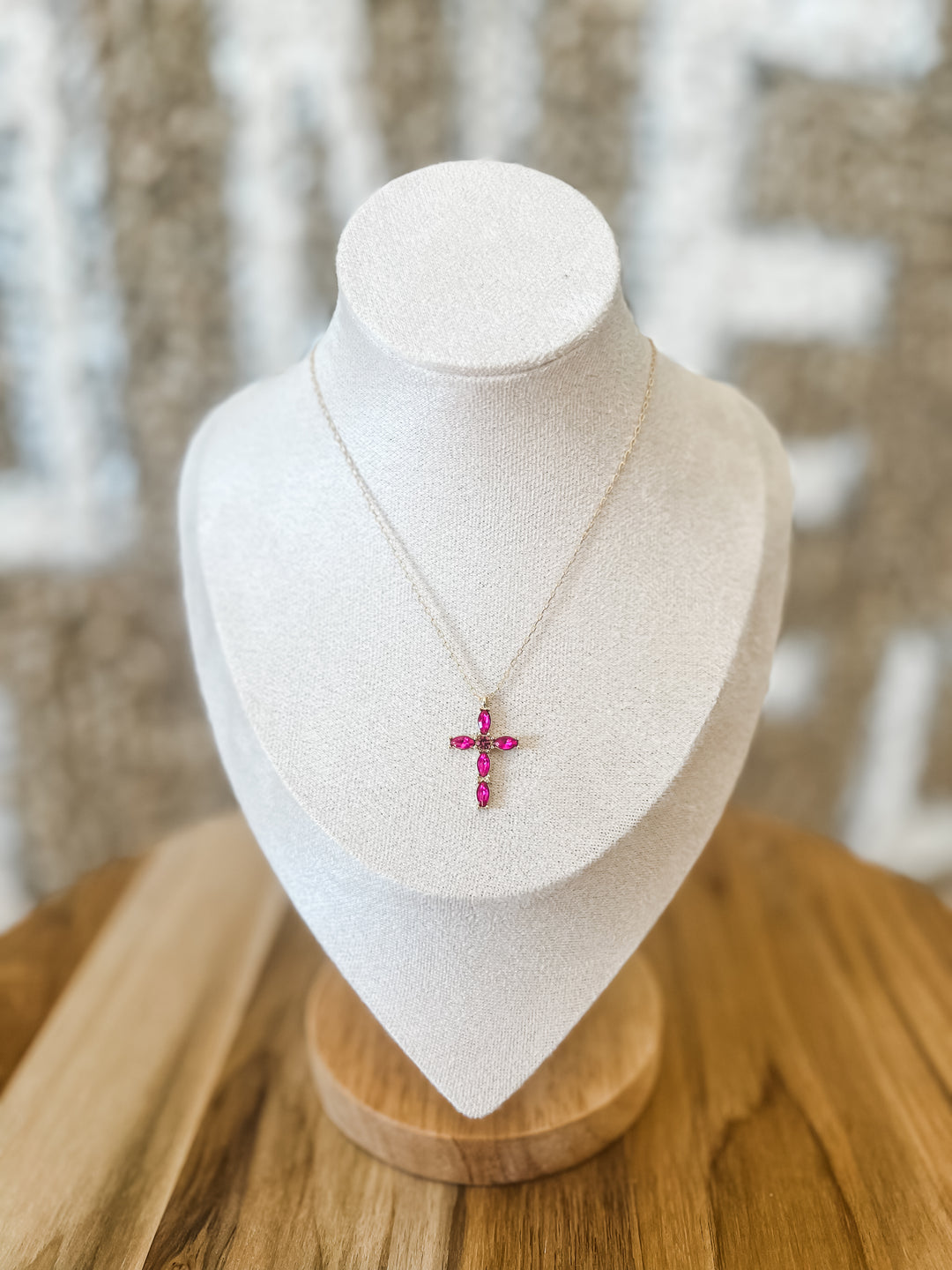 Gold necklace with fuchsia cross pendant