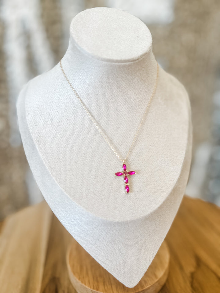 Gold necklace with fuchsia cross pendant