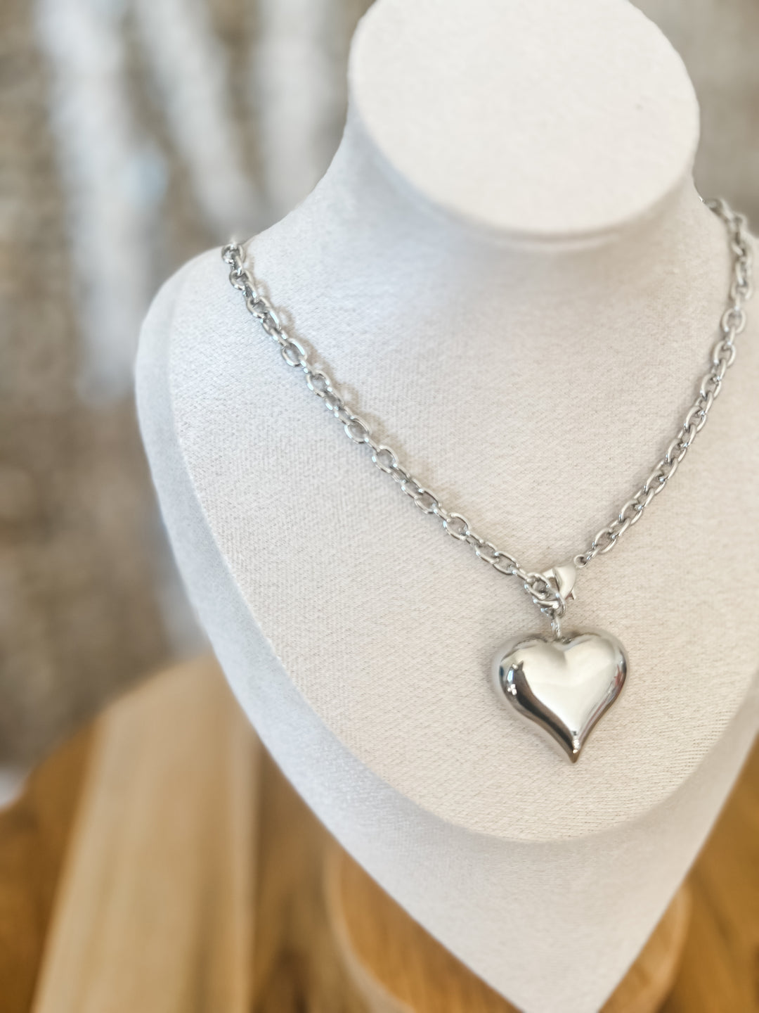 Silver heart-shaped pendant necklace
