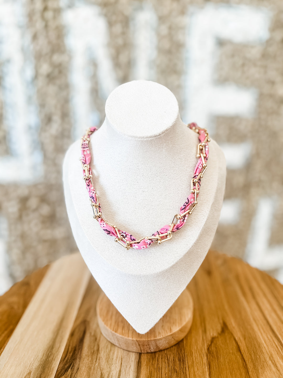 Pink bandana necklace woven into gold chain