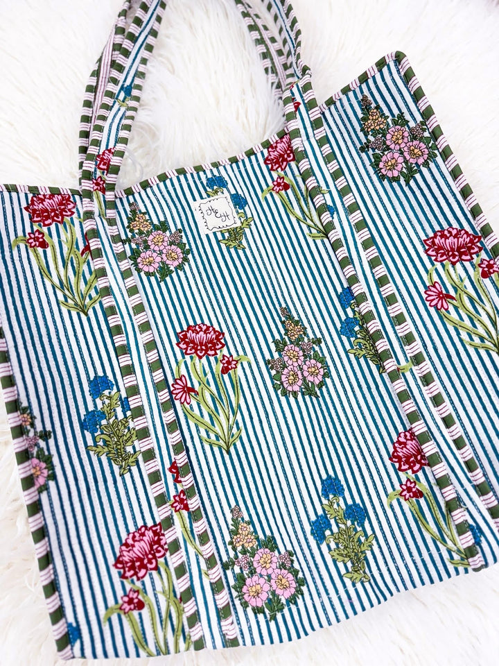 quilted striped tote bag with flower accents