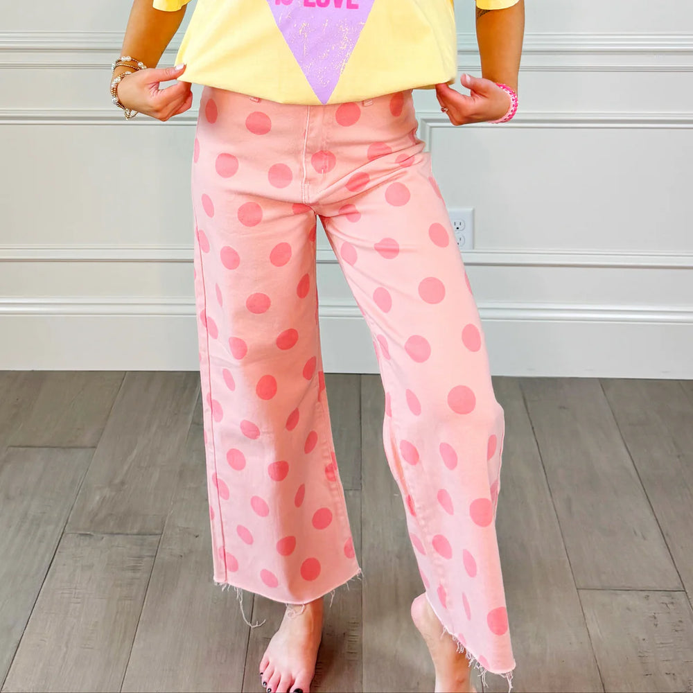 women wearing pink polka dot pants 