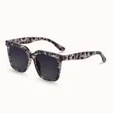 Sunglasses with a patterned frame on a white background