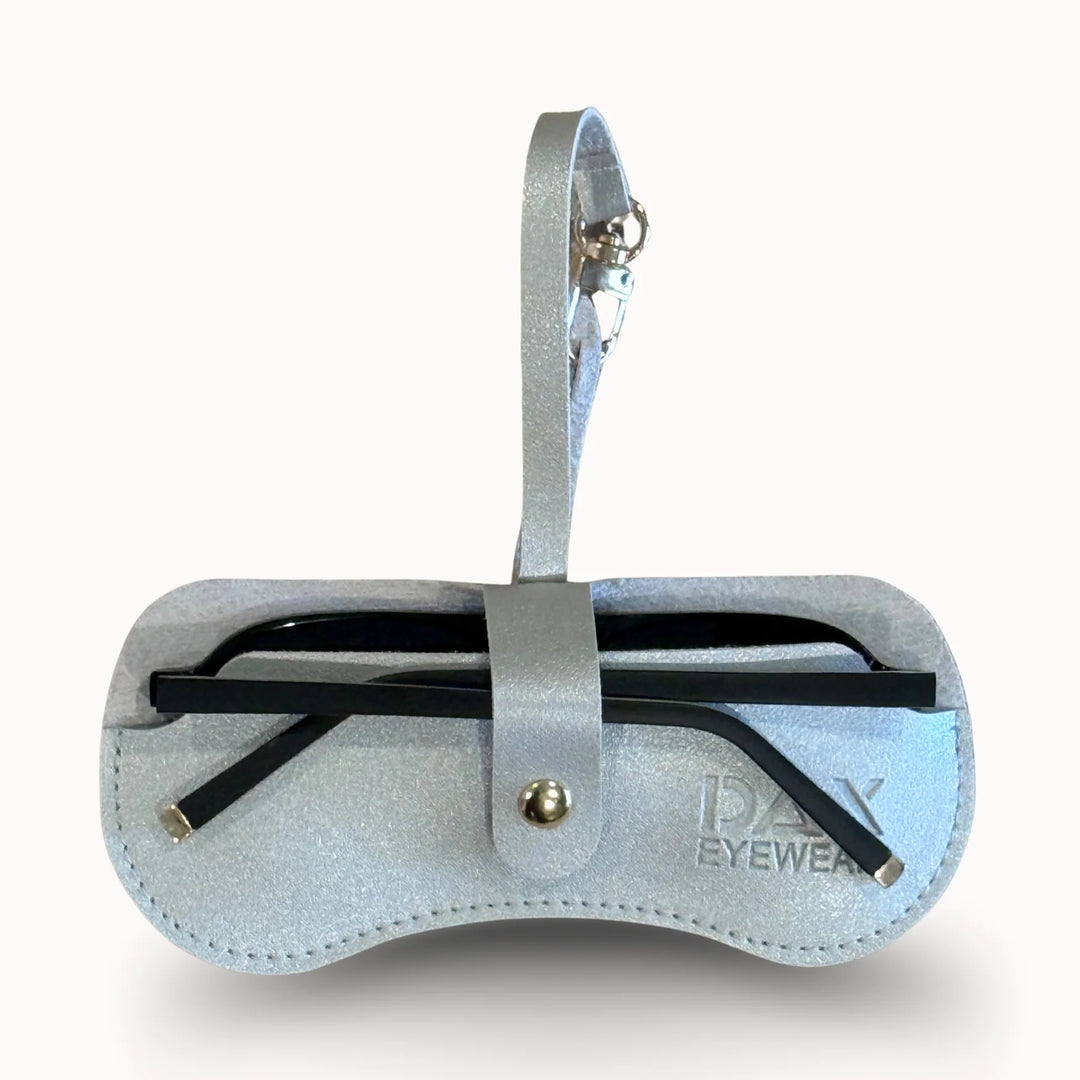Silver eyewear case with black glasses on a white background