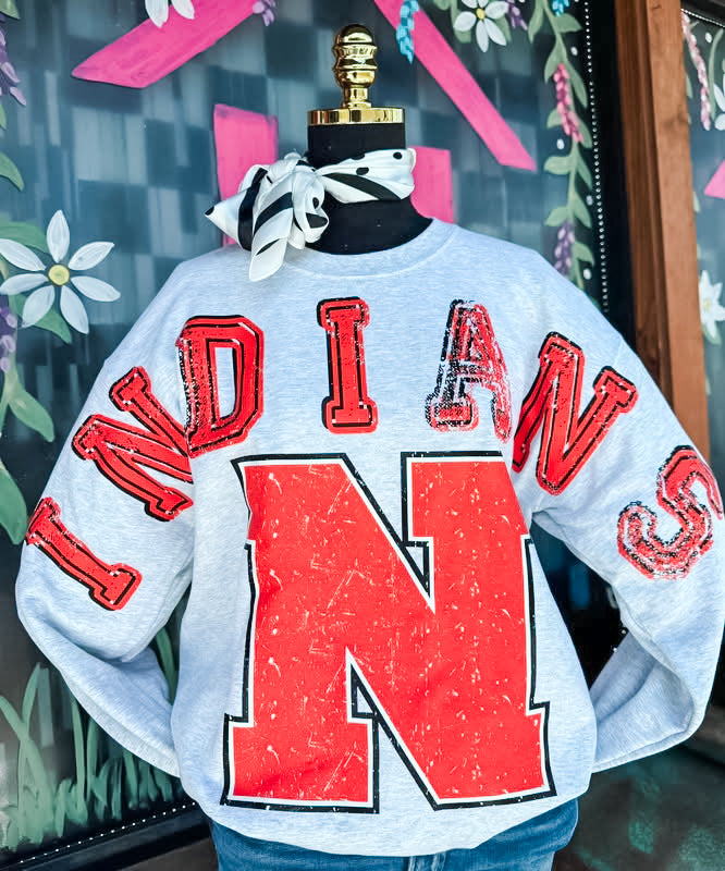 A light gray crewneck sweatshirt with a distressed orange and black &