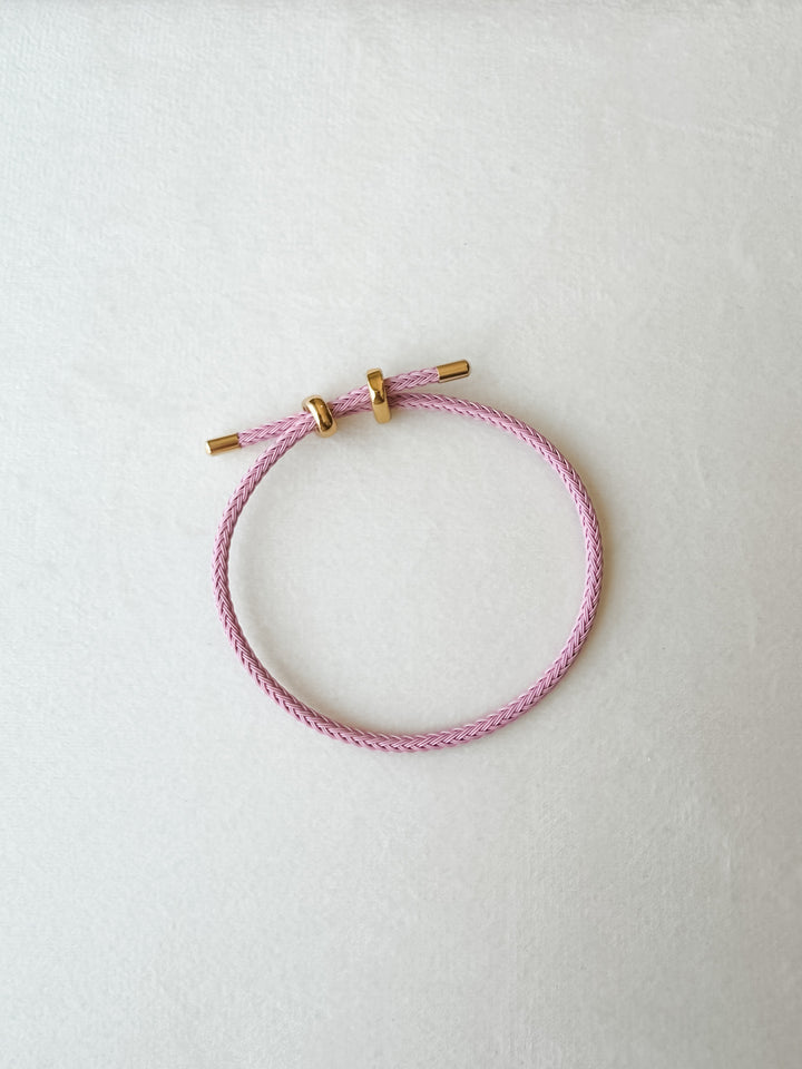 Light pink  adjustable paracord bracelet with gold accents