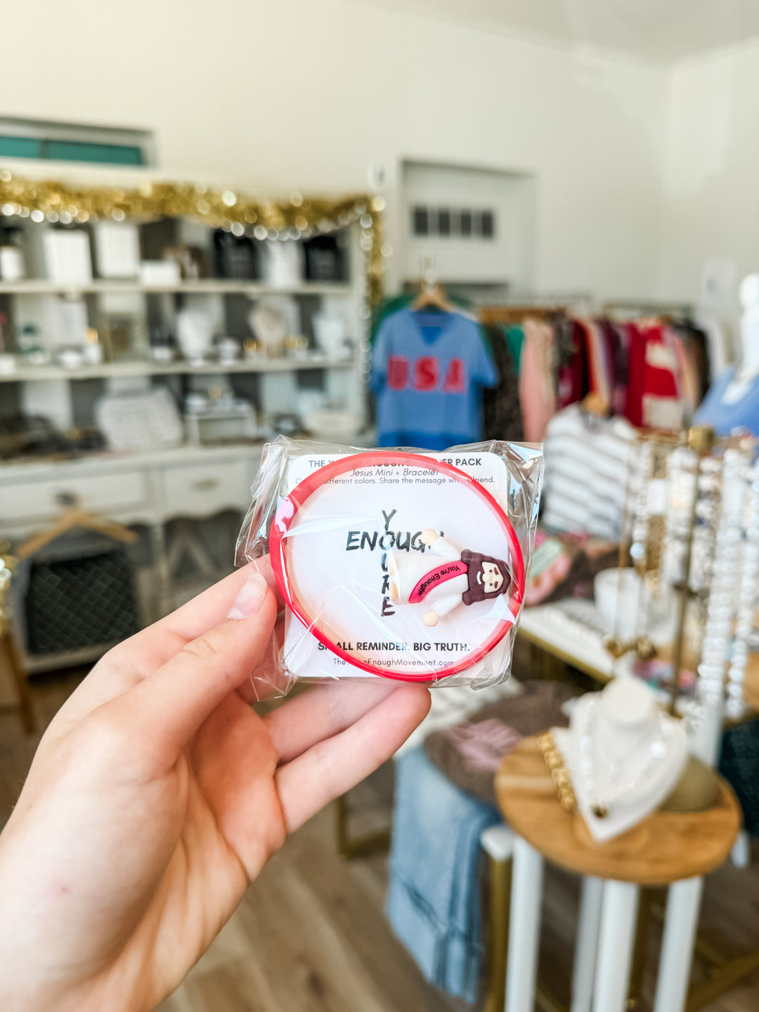 Mini Jesus figuring + Bracelet combo pack in red inside Nocona boutique 